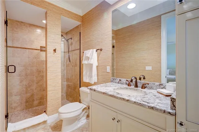 a view of a swimming pool with a chair and table in the patio