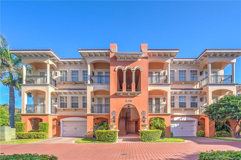 1528 Northeast Outrigger Landings Drive, Unit 208 Jensen Beach, FL 34957 - Photo 4 of 79 front view of a building
