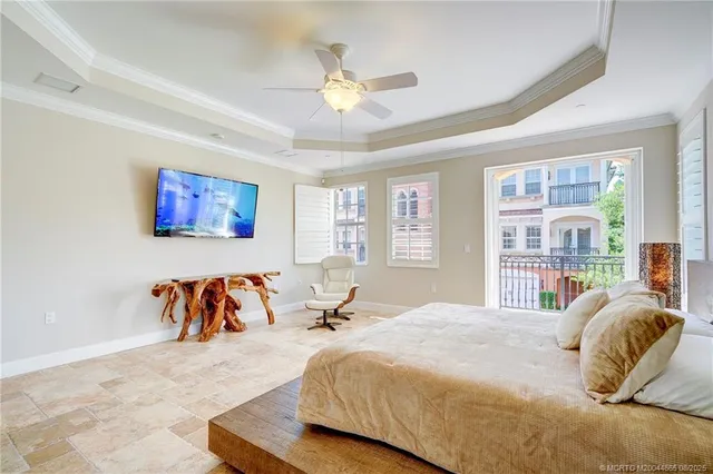 a view of a patio with table and chairs potted plants