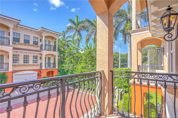 a small garden in front of a house with a yard