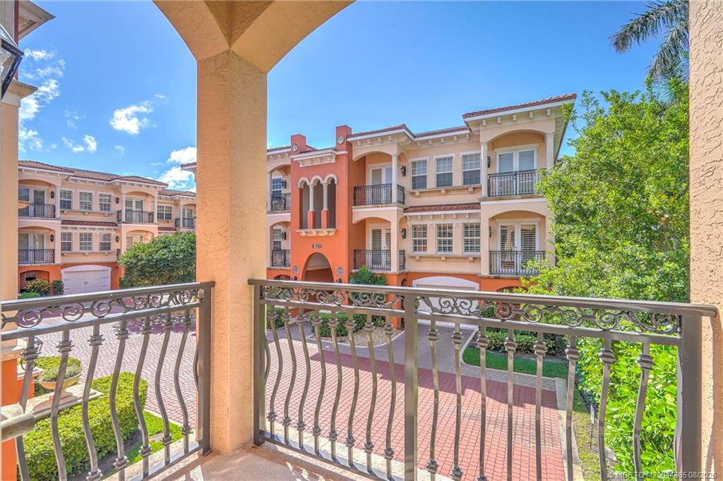 1528 Northeast Outrigger Landings Drive, Unit 208 Jensen Beach, FL 34957 - Photo 51 of 79 a view of a building from a balcony