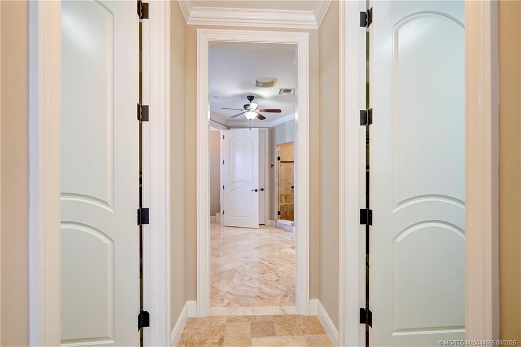 1528 Northeast Outrigger Landings Drive, Unit 208 Jensen Beach, FL 34957 - Photo 52 of 79 a view of a bathroom from a hallway