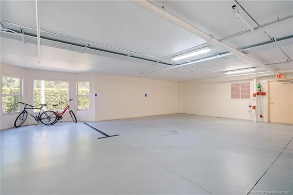 a view of open kitchen with seating space and furniture in it
