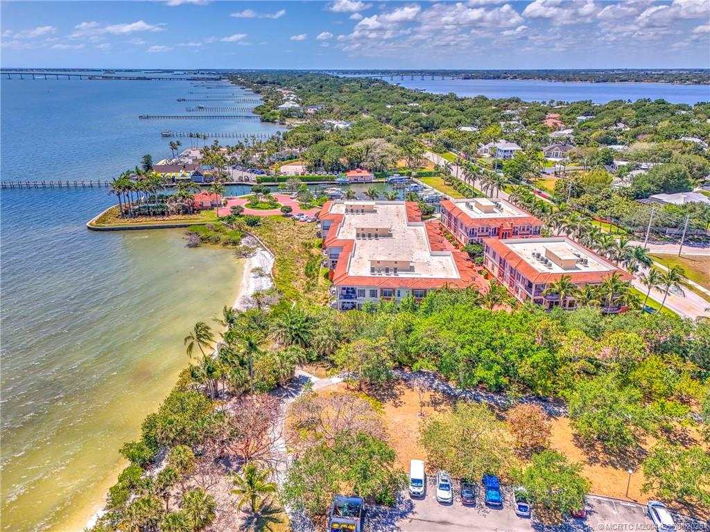 1528 Northeast Outrigger Landings Drive, Unit 208 Jensen Beach, FL 34957 - Photo 73 of 79 a view of a lake with a city