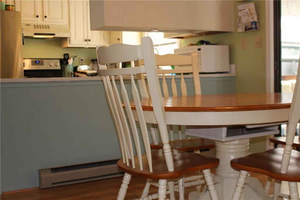 86 Flintlock Village Road, Unit 2 Wells, ME 04090 - Photo 5 of 28 An ample dining area, adjacent to...