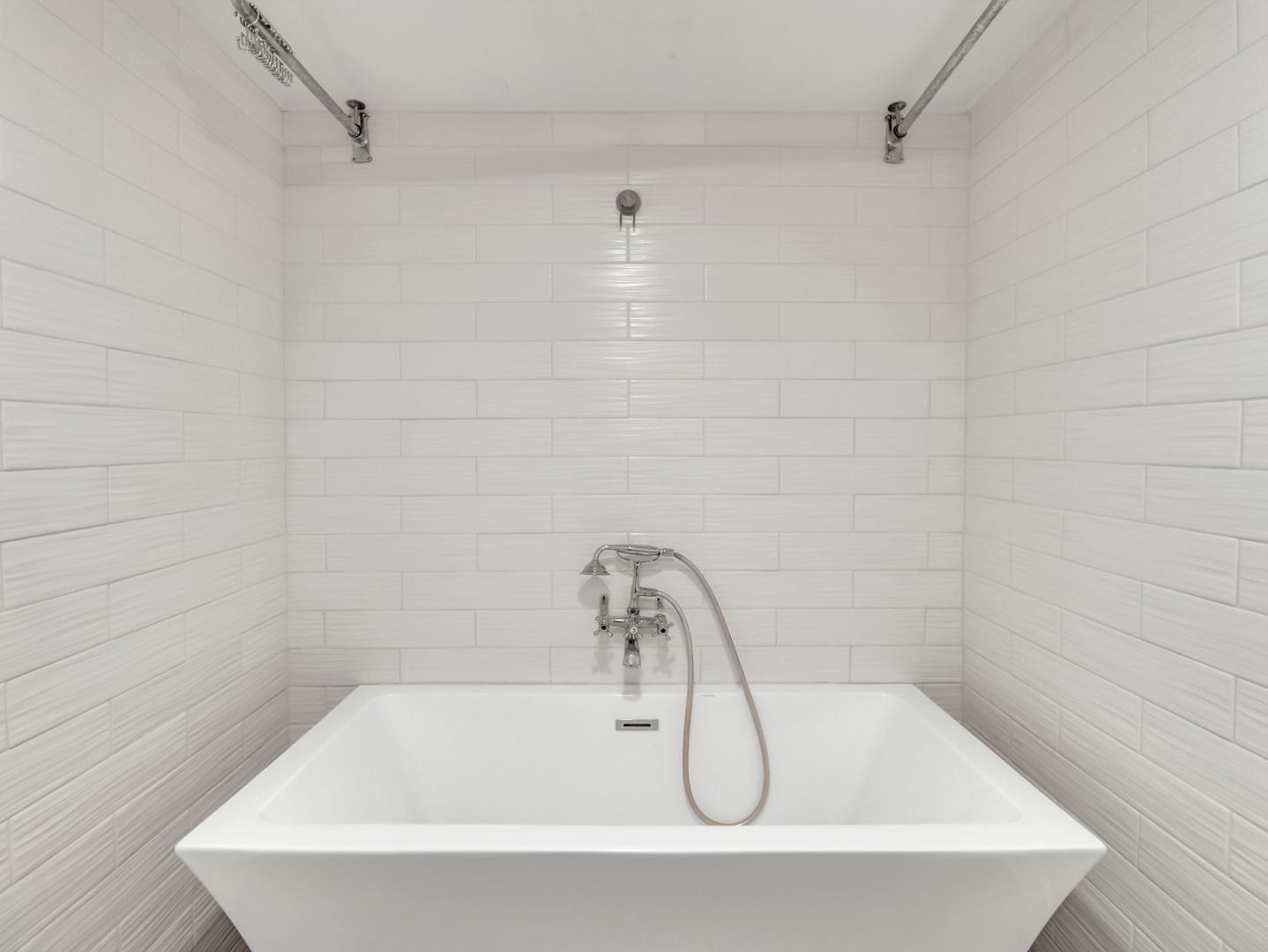 544 West 17th Place Tempe, AZ 85281 - Photo 32 of 38 a white bath tub sitting in a bathroom