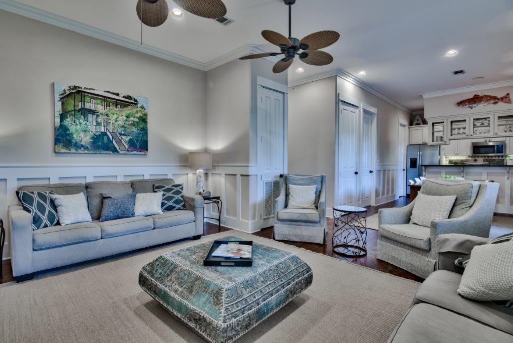 309 Defuniak Street Santa Rosa Beach, FL 32459 - Photo 12 of 53 a living room with furniture a rug and a chandelier