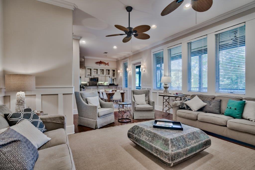 309 Defuniak Street Santa Rosa Beach, FL 32459 - Photo 13 of 53 a living room with furniture a rug and a chandelier