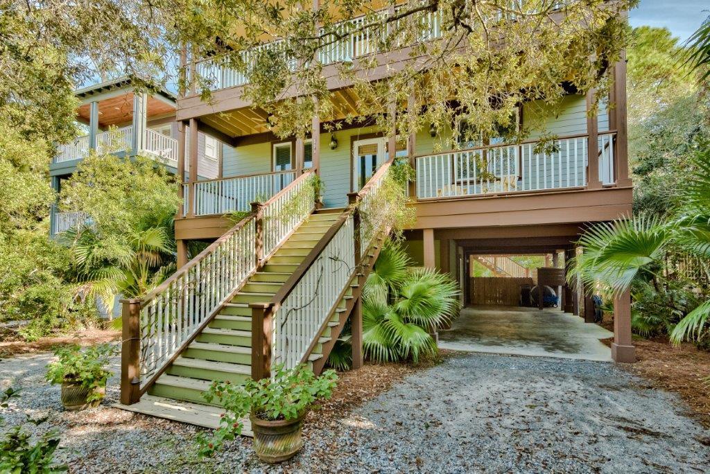 309 Defuniak Street Santa Rosa Beach, FL 32459 - Photo 2 of 53 a front view of a house with a yard