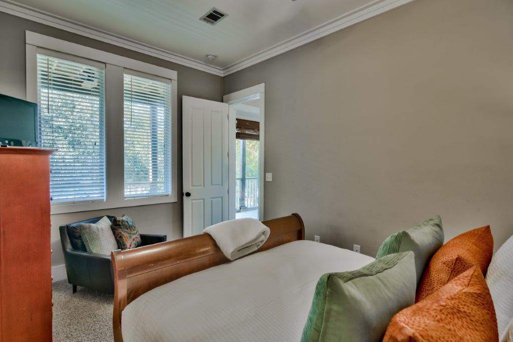 309 Defuniak Street Santa Rosa Beach, FL 32459 - Photo 22 of 53 a bedroom with a bed couch and window