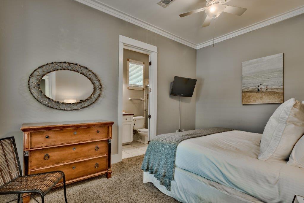 309 Defuniak Street Santa Rosa Beach, FL 32459 - Photo 25 of 53 a bedroom with a bed and a dresser