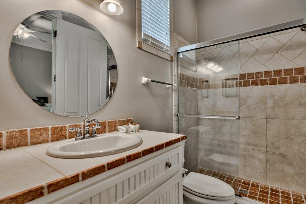 309 Defuniak Street Santa Rosa Beach, FL 32459 - Photo 26 of 53 a bathroom with a sink a toilet and shower
