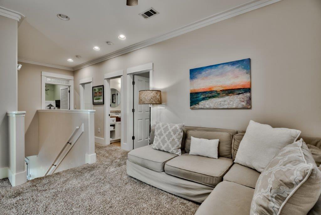 309 Defuniak Street Santa Rosa Beach, FL 32459 - Photo 29 of 53 a living room with furniture and a flat screen tv