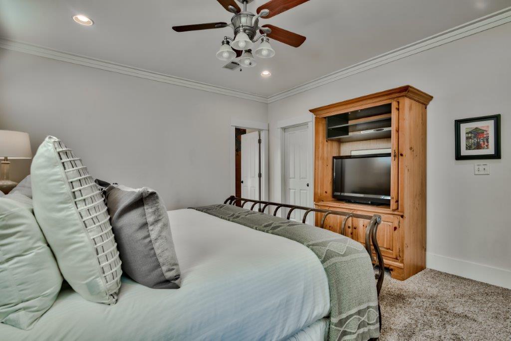309 Defuniak Street Santa Rosa Beach, FL 32459 - Photo 31 of 53 a bedroom with bed and a flat screen tv