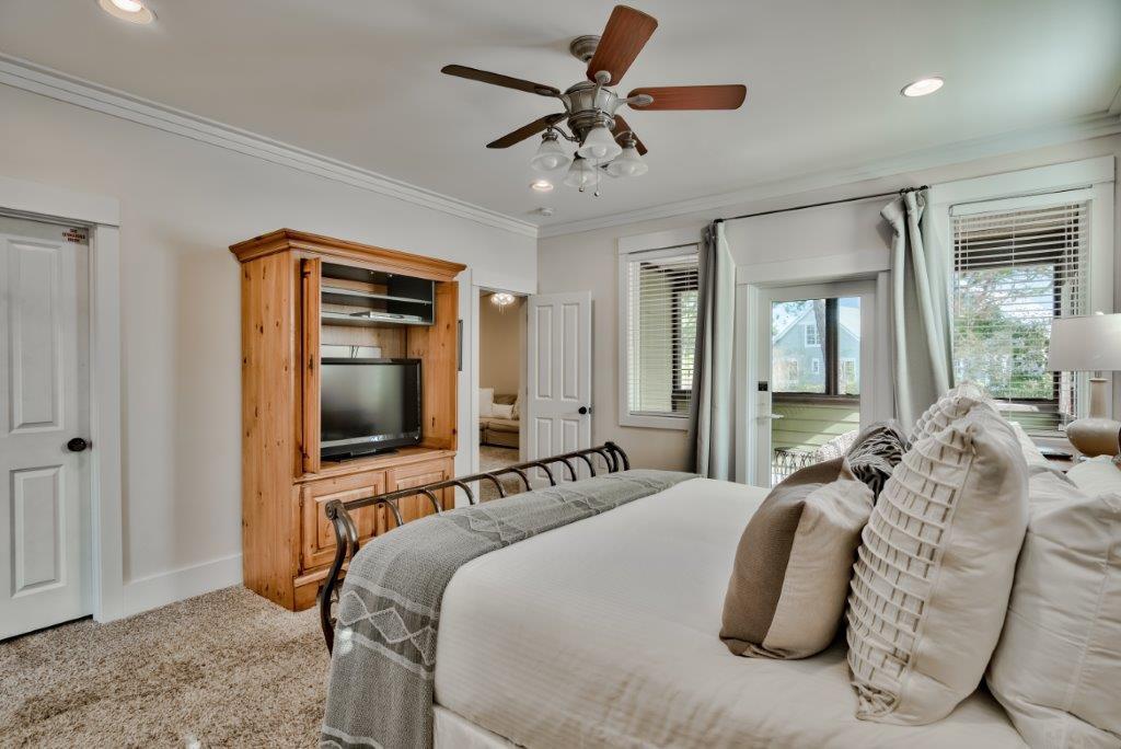 309 Defuniak Street Santa Rosa Beach, FL 32459 - Photo 32 of 53 a bedroom with bed and a flat tv screen