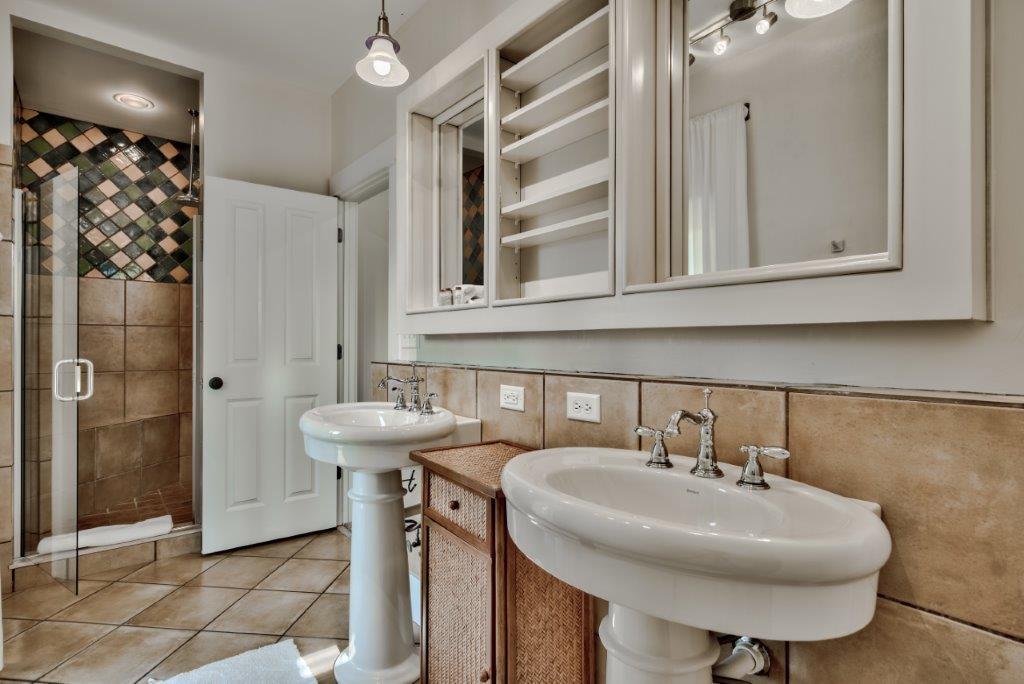 309 Defuniak Street Santa Rosa Beach, FL 32459 - Photo 33 of 53 a bathroom with a sink a toilet and shower