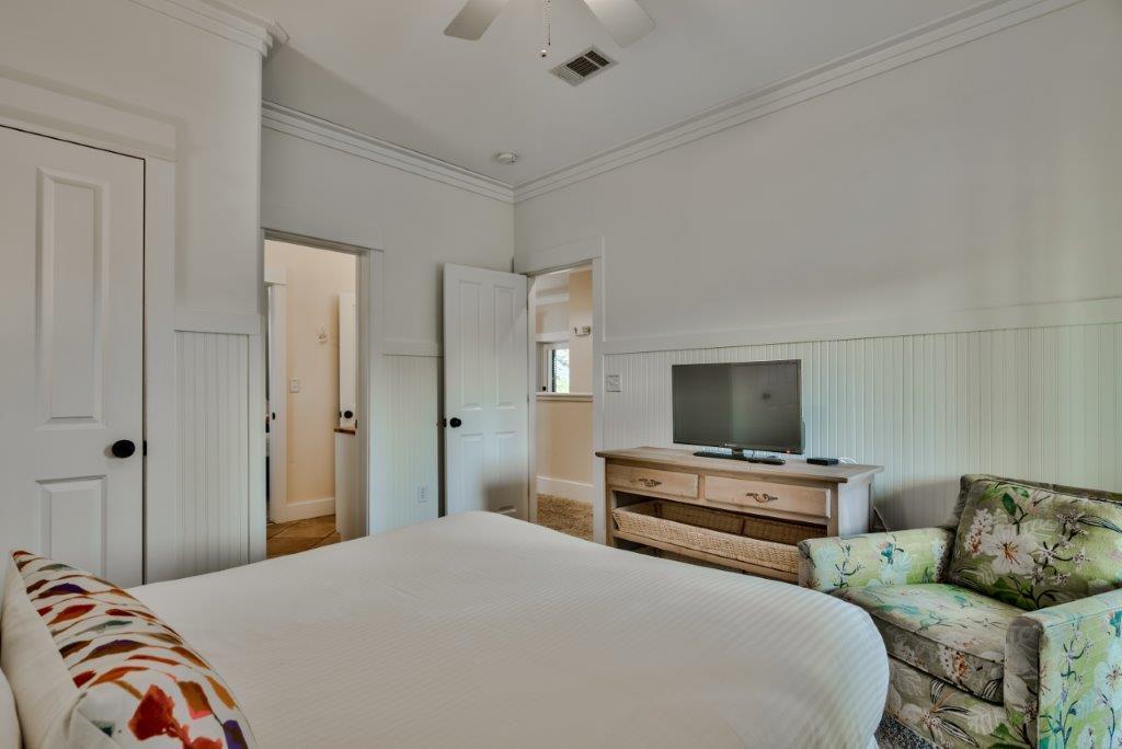 309 Defuniak Street Santa Rosa Beach, FL 32459 - Photo 39 of 53 a bedroom with bed and flat screen tv