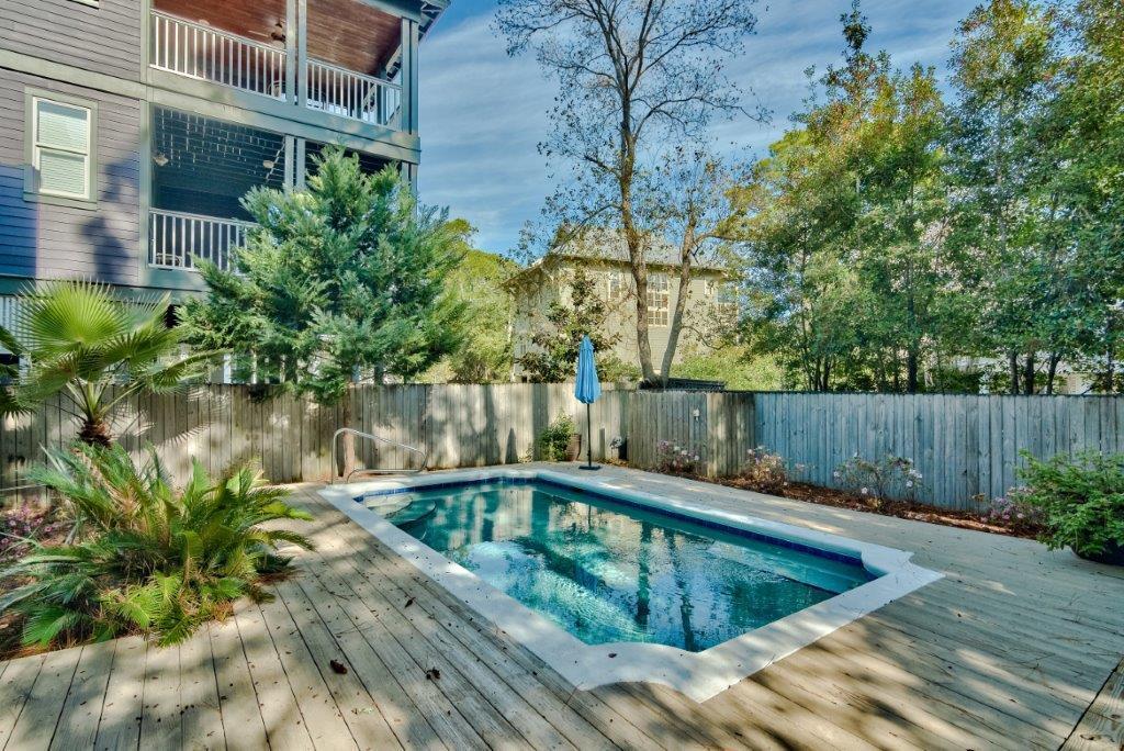 309 Defuniak Street Santa Rosa Beach, FL 32459 - Photo 5 of 53 a view of a swimming pool with a yard
