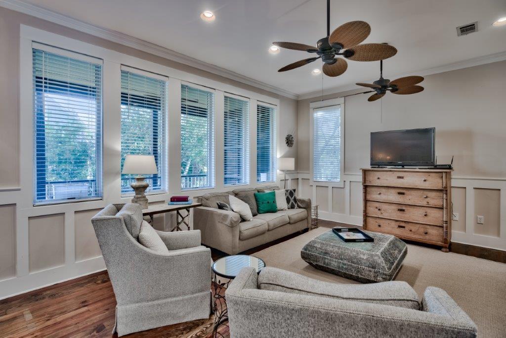 309 Defuniak Street Santa Rosa Beach, FL 32459 - Photo 10 of 53 a living room with furniture ceiling fan and a window