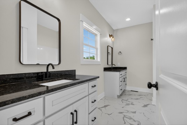 1233 Coleytown Road Lafayette, TN 37083 - Photo 21 of 39 a bathroom with a sink and a mirror