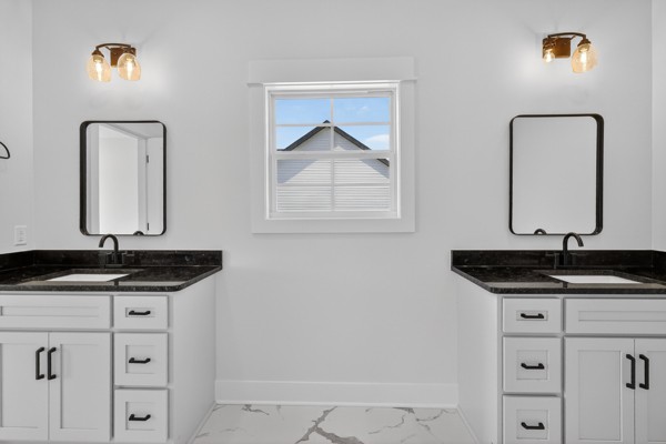 1233 Coleytown Road Lafayette, TN 37083 - Photo 22 of 39 a bathroom with a granite countertop sink and mirror