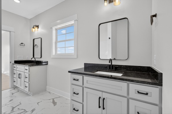 1233 Coleytown Road Lafayette, TN 37083 - Photo 24 of 39 a bathroom with a double vanity sink and mirror