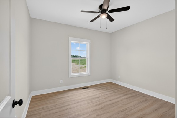 1233 Coleytown Road Lafayette, TN 37083 - Photo 27 of 39 an empty room with wooden floor and windows