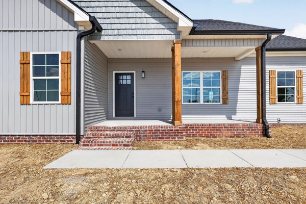 1233 Coleytown Road Lafayette, TN 37083 - Photo 4 of 39 a view of a house with a patio