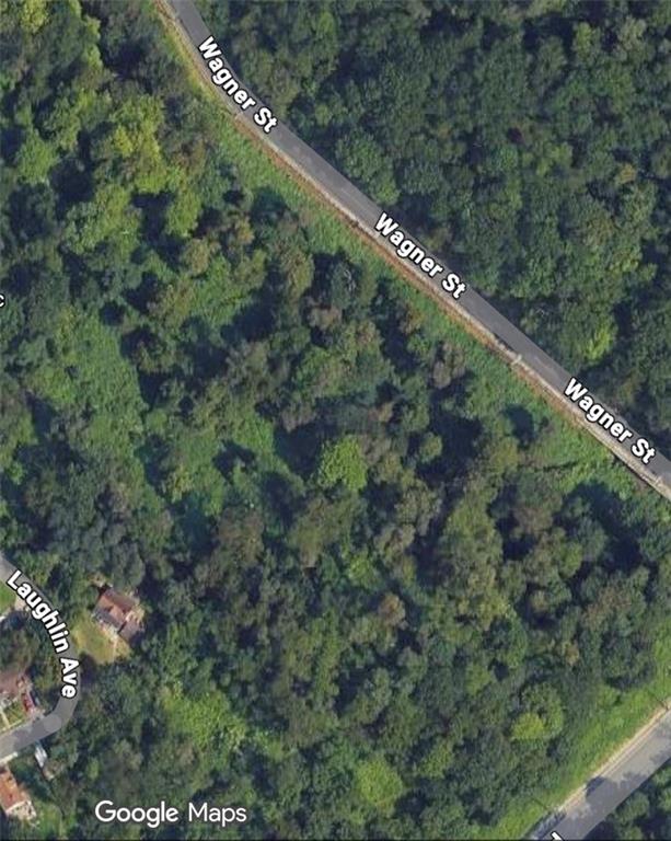 a view of a city with lush green forest