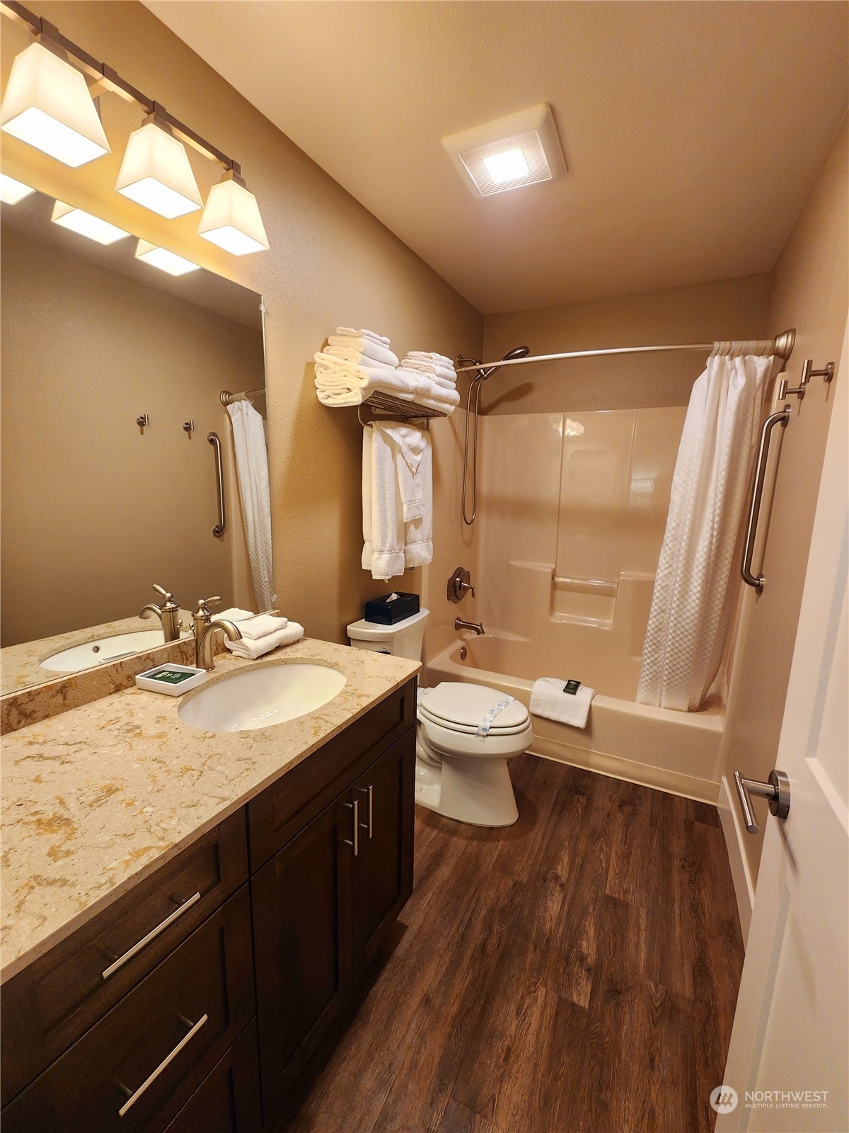 1 Lakeside 709-o Manson, WA 98831 - Photo 11 of 39 a bathroom with a granite countertop sink toilet and shower