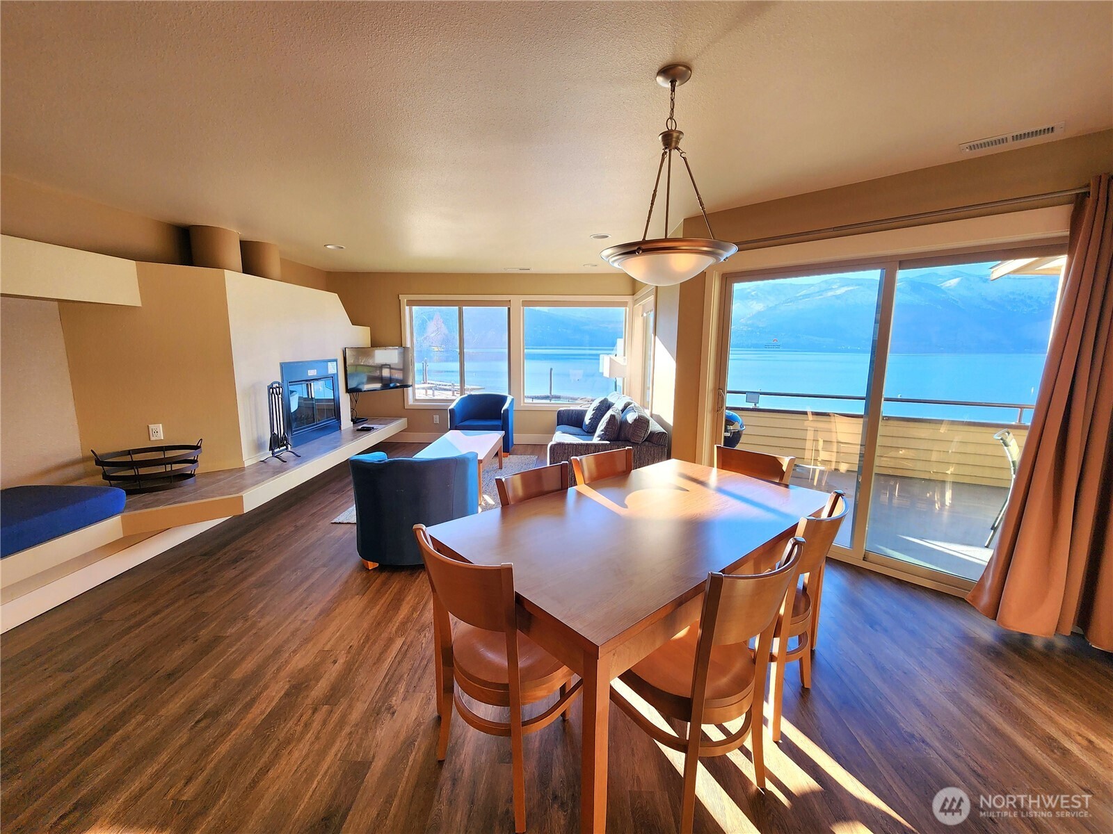 1 Lakeside 709-o Manson, WA 98831 - Photo 2 of 39 a view of a dining room with furniture window and wooden floor