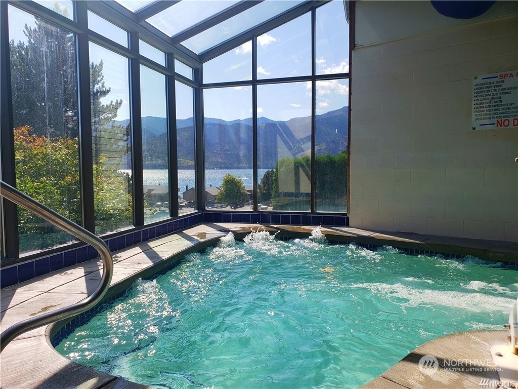 1 Lakeside 709-o Manson, WA 98831 - Photo 34 of 39 a house with swimming pool in front of it