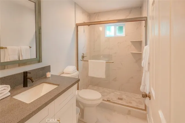 a bedroom with a bed and a table