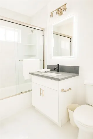 a bedroom with a bed and a table