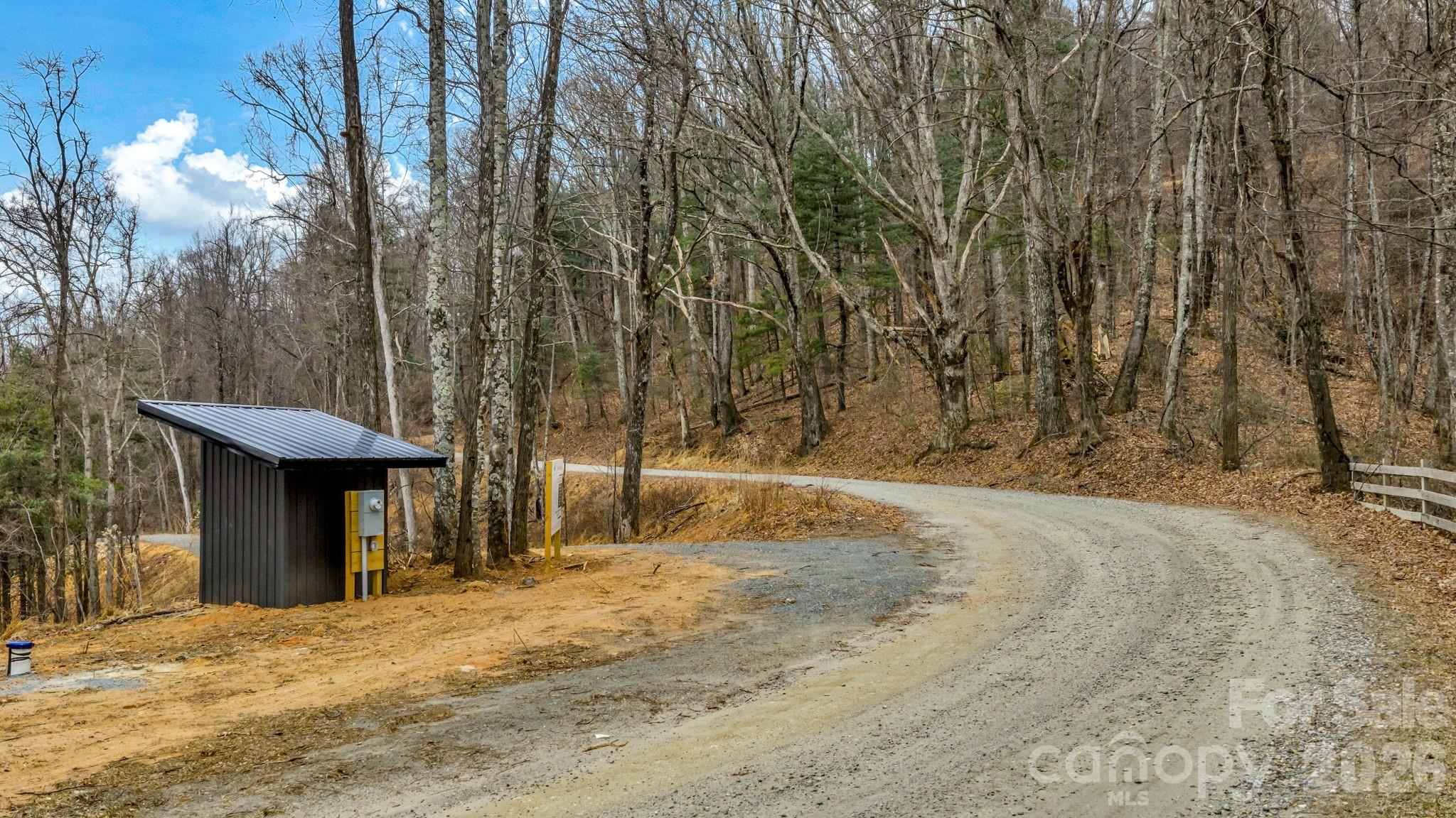 Tbd Phillips Gap Road Purlear, NC 28665 - Photo 6 of 20 a front view of a house with a yard and garage