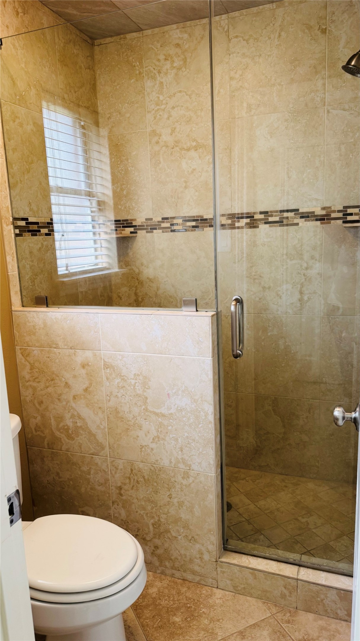 3310 Glen Spring Drive Houston, TX 77339 - Photo 14 of 18 a bathroom with a toilet and a shower