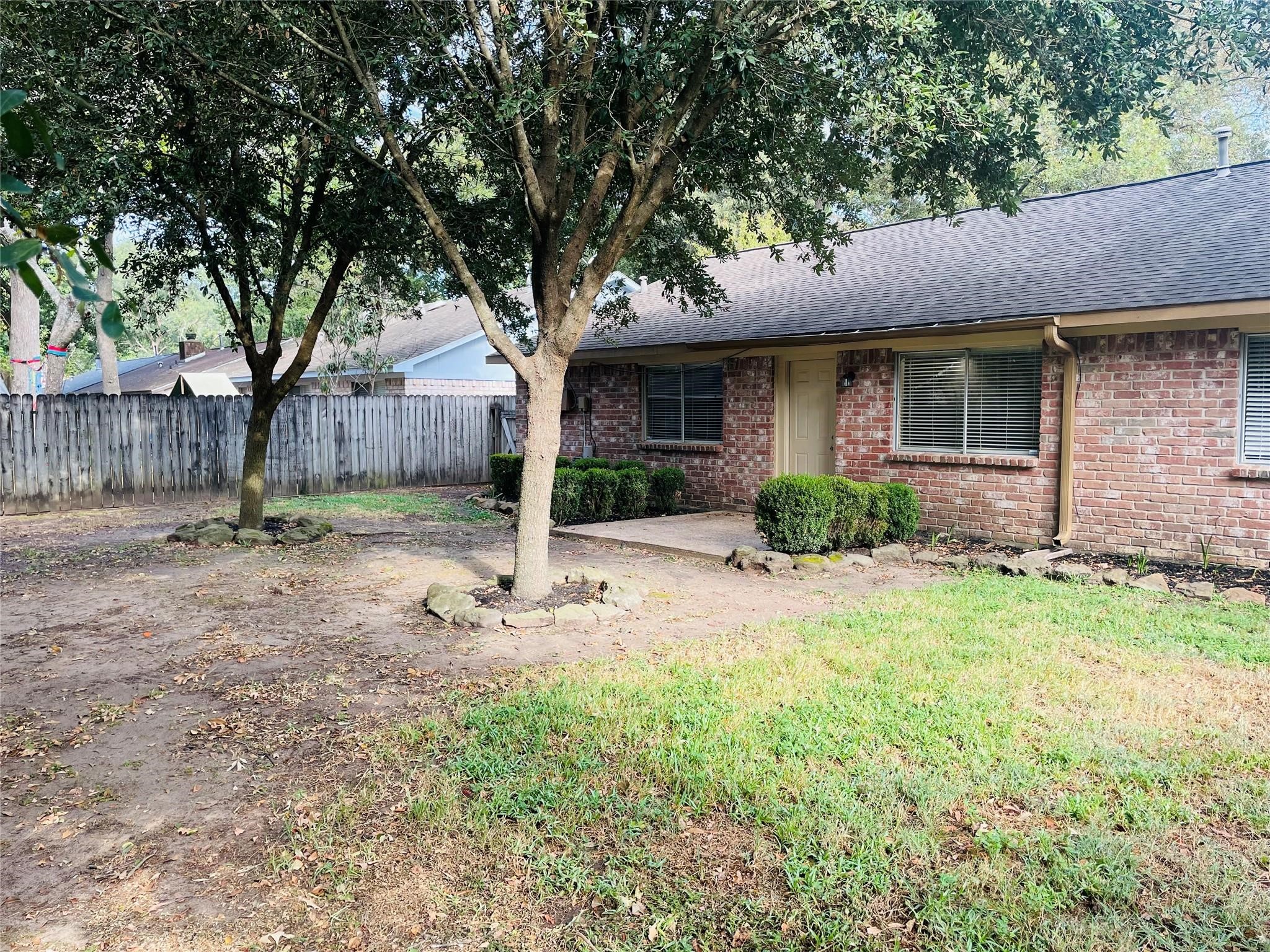 3310 Glen Spring Drive Houston, TX 77339 - Photo 18 of 18 a front view of a house with garden