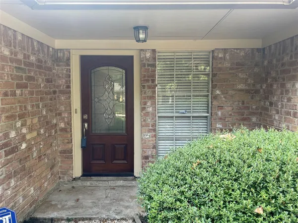 a front view of a house with a glass door