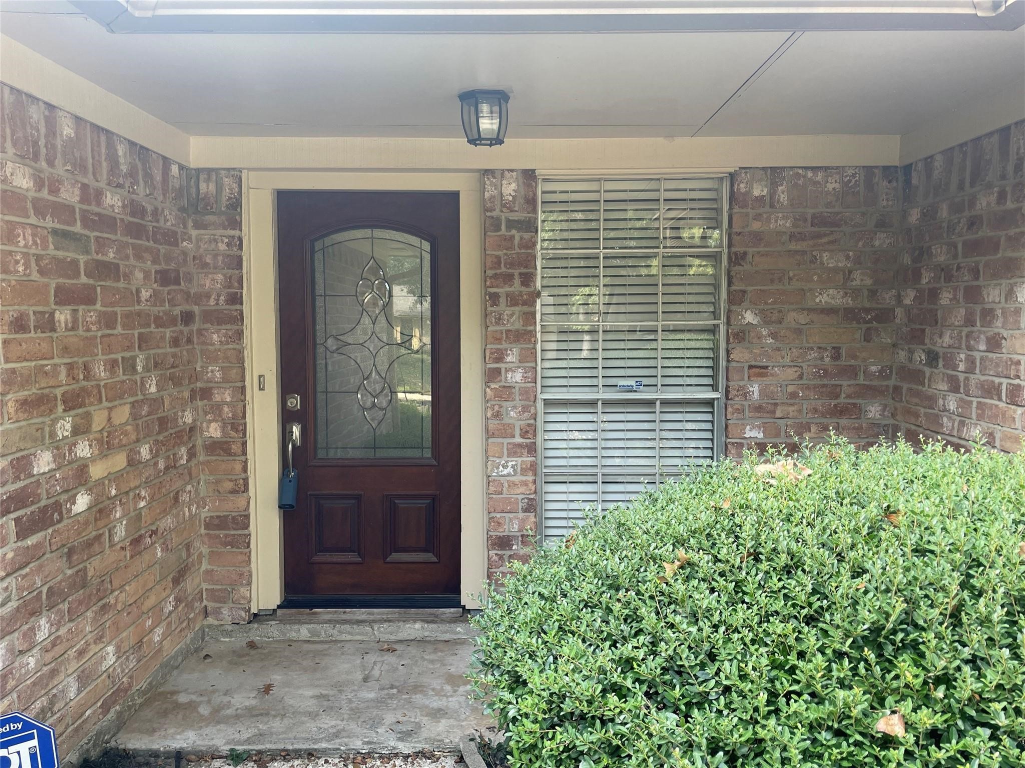 3310 Glen Spring Drive Houston, TX 77339 - Photo 2 of 18 a front view of a house with a glass door