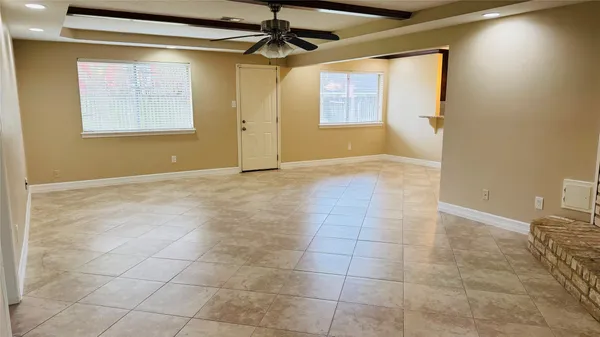 a view of an empty room and window