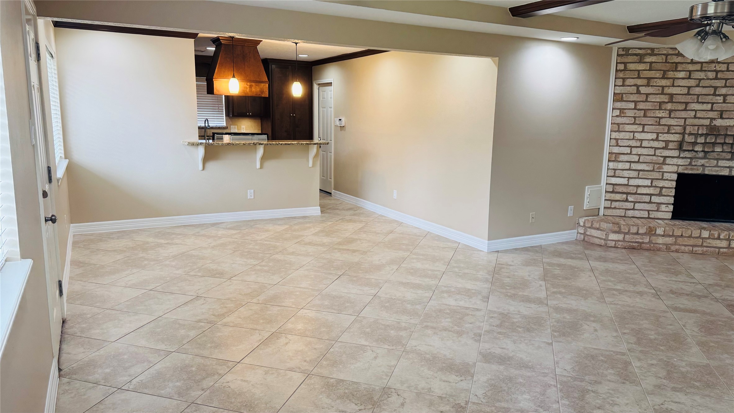 3310 Glen Spring Drive Houston, TX 77339 - Photo 6 of 18 a view of a livingroom with wooden floor and a kitchen