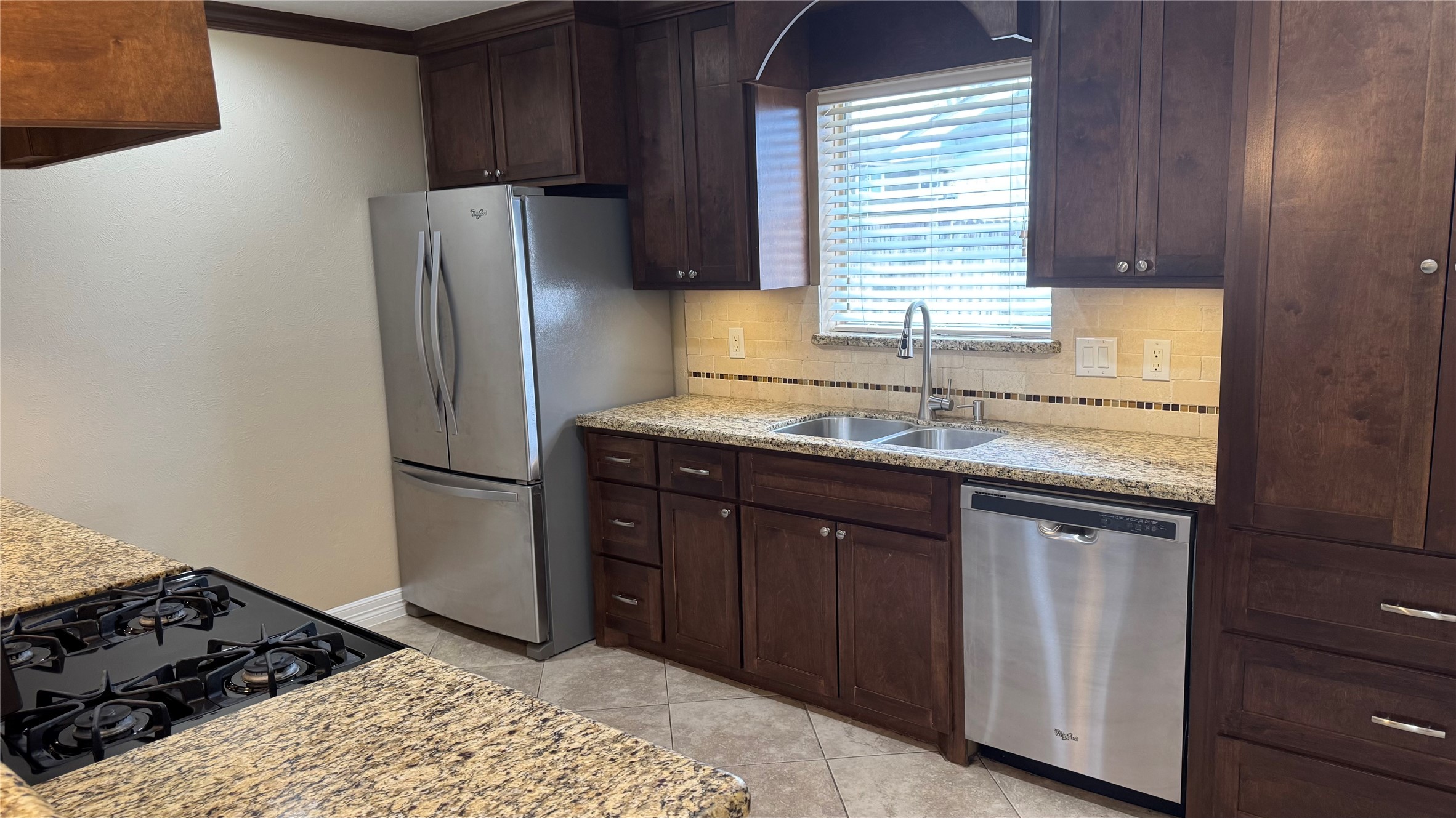 3310 Glen Spring Drive Houston, TX 77339 - Photo 10 of 18 a kitchen with stainless steel appliances granite countertop a refrigerator and a sink