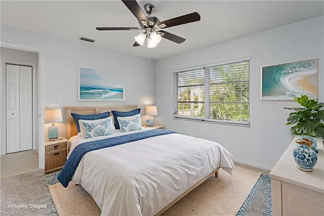 a bedroom with a large bed and a window