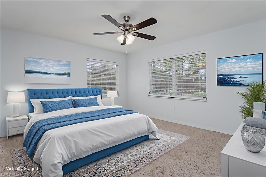 180 Cypress Way East, Unit B212 Naples, FL 34110 - Photo 21 of 40 a bedroom with bed and window