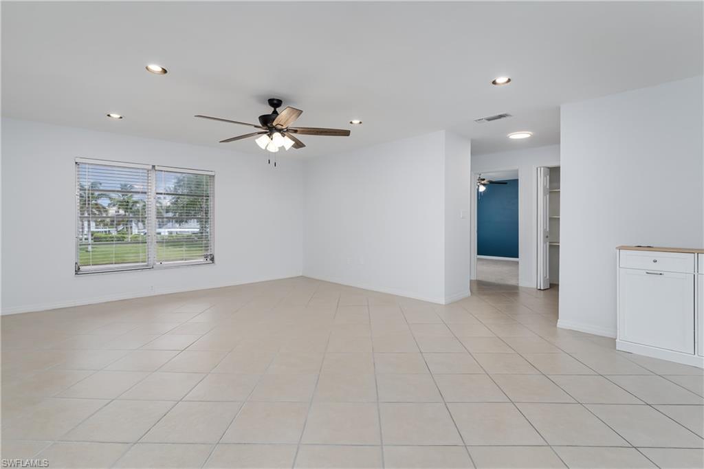 180 Cypress Way East, Unit B212 Naples, FL 34110 - Photo 3 of 40 a view of an empty room with a window