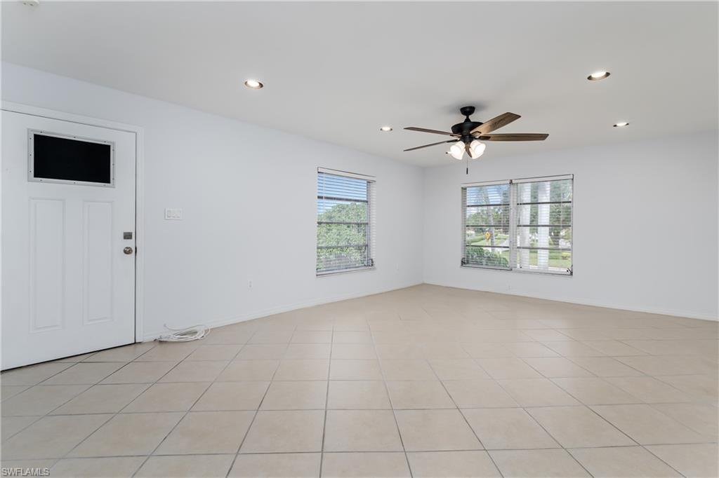 180 Cypress Way East, Unit B212 Naples, FL 34110 - Photo 4 of 40 a view of an empty room with a window