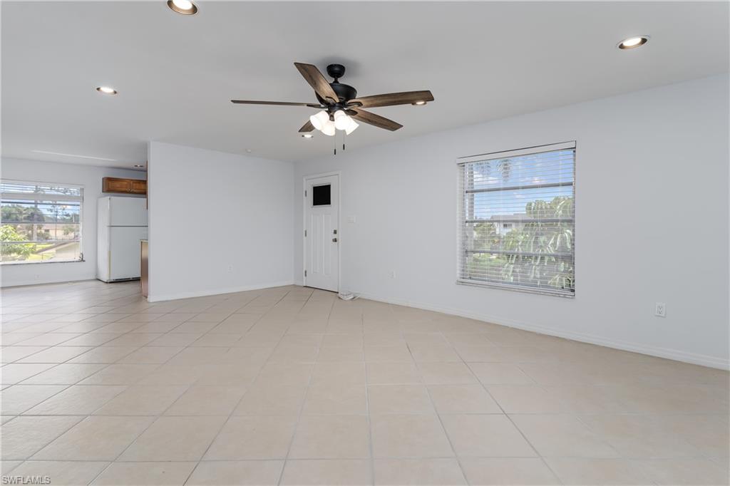 180 Cypress Way East, Unit B212 Naples, FL 34110 - Photo 7 of 40 a view of an empty room with a window