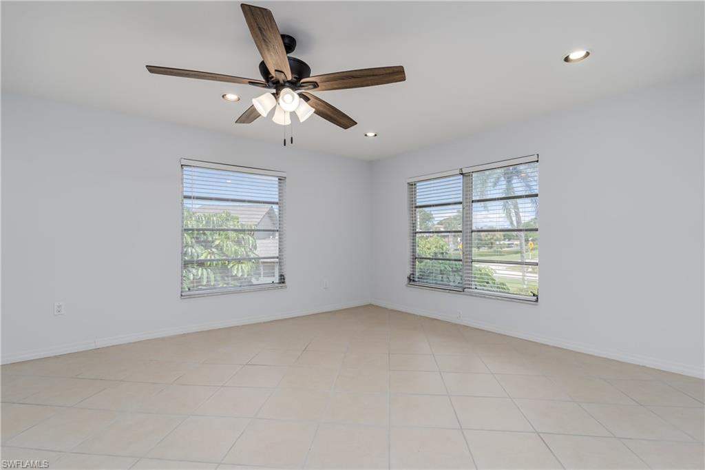 180 Cypress Way East, Unit B212 Naples, FL 34110 - Photo 8 of 40 a view of an empty room with a window