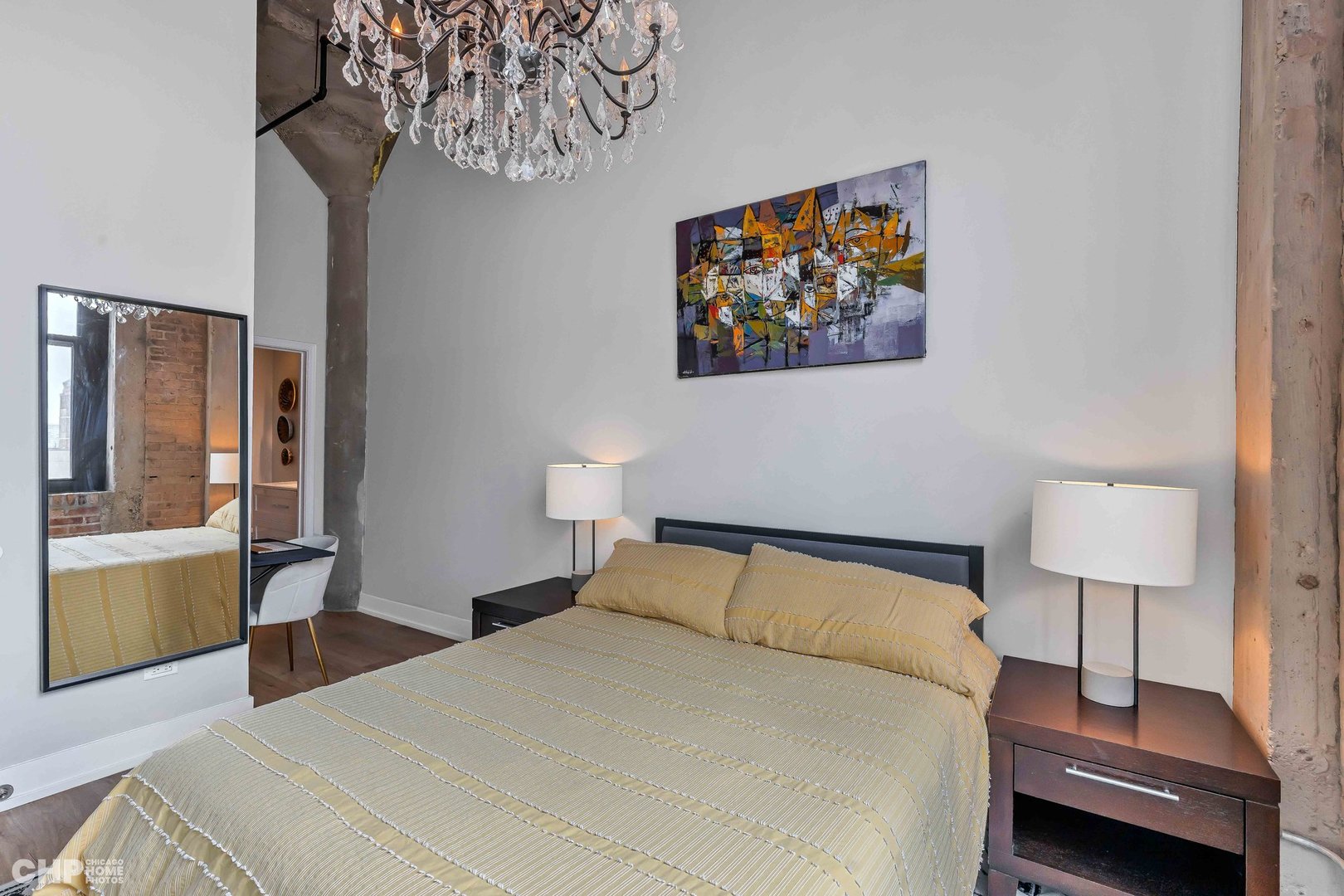 320 East 21st Street, Unit 617 Chicago, IL 60616 - Photo 11 of 23 a bedroom with a bed and a lamp on table