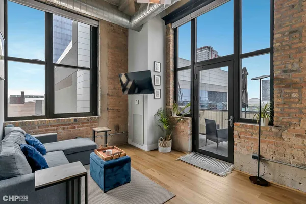 a living room with furniture and a large window